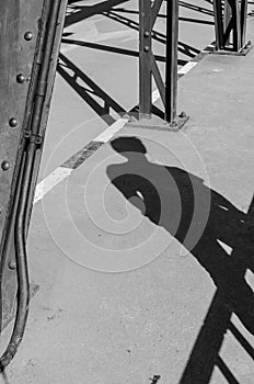 Tourist shadow on bridge