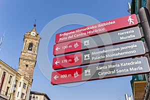 Tourist sign and church tower in Vitoria Gasteiz