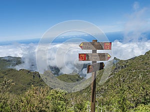 Tourist Signpost at hiking trail PR1.2 to Pico Ruivo the highest peak and Achada do Teixeira and PR1.1 to Ilha, Madeira photo