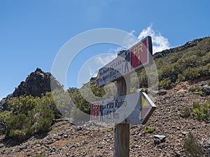 Tourist Signpost at hiking trail PR1.2 to Pico Ruivo - at 1,861 m the highest mountain and PR1 to Pico Areiro second