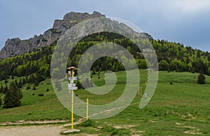 Tourist signposts on mountain pass Medziholie in national park Mala Fatra, natural reserve Velky Rozsutec, Slovakia, spring cloudy