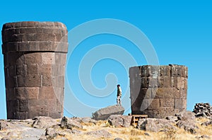 Tourist Silustani tombs peruvian Andes Puno Peru photo