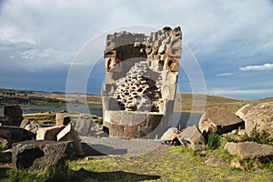 Tourist at the Silustani tombs in the peruvian Andes at Puno Peru