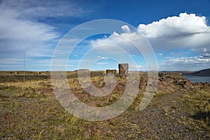 Tourist at the Silustani tombs in the peruvian Andes at Puno Peru