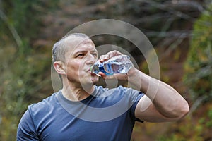 tourist sits and drinks water
