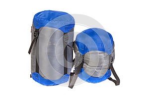Tourist sleeping bags packed with varying degrees of compressio
