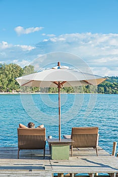 Tourist sleeping in chair beach at luxury resort, Phuket, Thauland.