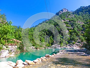 Tourist sliding on a zip line in the canyon of Harmony, near the town of Goynuk and Antalya