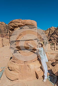 Tourist standing roman temple in nabatean city of petra jordan