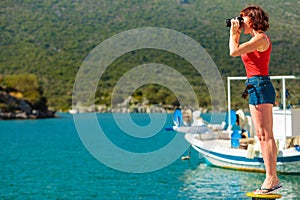 Tourist take photo in greek marina