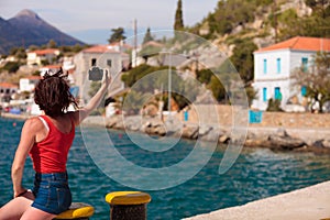 Tourist take photo in greek marina