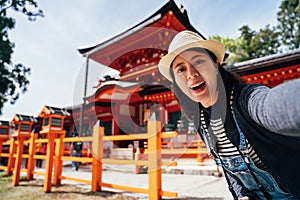 Tourist take self portrait kasuga taisha