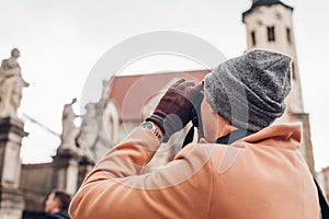 Tourist takes pictures of St Peter and Paul church in Krakow  Poland. Sightseeing around landmarks and architecture