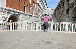 tourist takes a selfie in front of Bridge of Sighs in Venice completely alone during the lockdown exceptional and unrepeatable