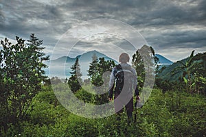 Tourist takes a snapshot of the Batur volcano from Kintamani, Ba