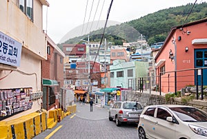 Tourist are taking photo with the art work decoration in the street of Gamcheon Culture Village, Busan
