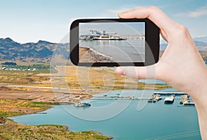 Tourist taking photo of Boulder Beach on Lake Mead