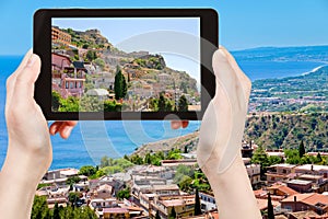 Tourist taking photo city Taormina