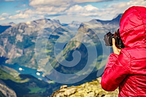 Tourist taking photo from Dalsnibba viewpoint Norway