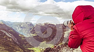 Tourist taking photo from Dalsnibba viewpoint Norway