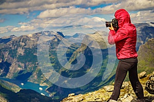 Tourist taking photo from Dalsnibba viewpoint Norway