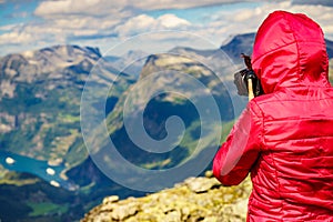 Tourist taking photo from Dalsnibba viewpoint Norway