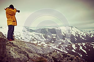 Tourist taking photo from Dalsnibba viewpoint Norway