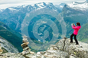 Tourist taking photo from Dalsnibba viewpoint Norway