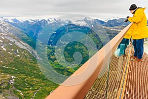 Tourist taking photo from Dalsnibba viewpoint Norway