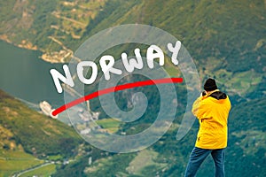 Tourist taking photo from Dalsnibba viewpoint Norway