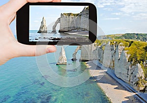 Tourist taking photo of english channel with cliff