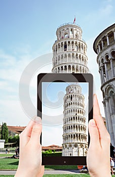 Tourist taking photo of Leaning Tower of Pisa