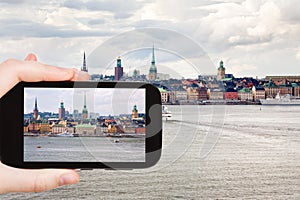 Tourist taking photo panorama of Stockholm city