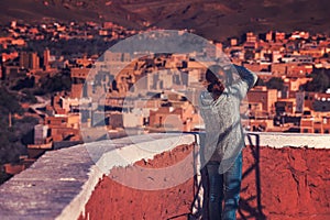 Tourist taking a photo of rural berber village
