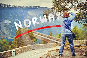 Tourist taking photo from Stegastein viewpoint Norway