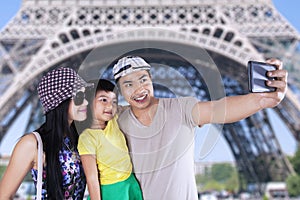 Tourist taking picture in eiffel tower