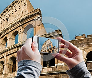 Tourist taking a picture of Great Colosseum, Rome