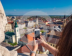 Tourist taking pictures in Oradea Romania