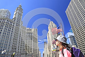 Tourist teenager admiring Chicago skyline on Michigan Avenue