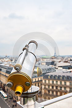 Tourist telescope over Paris landscape