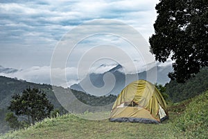 Tourist tent in camp among meadow in the mountain