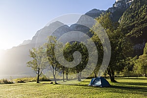 Tourist tent in mountains. Camping holidays. Alps. Switzerland