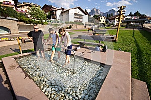 Tourist in therapeutic pool in Castelrotto, Italy