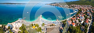 Tourist town of Selce and Poli Mora turquoise beach aerial panoramic view photo