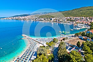 Tourist town of Selce and Poli Mora turquoise beach aerial view photo