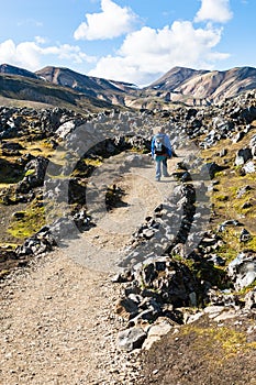 Tourist on trail at Laugahraun volcanic lava field