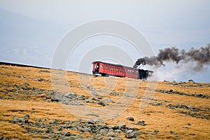 Tourist Train on Mt Washington in a Fall Cloudy Day