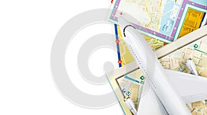 tourist travel concept, closeup aircraft toy and maps