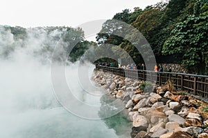 Tourist travel in the famous Beitou Thermal Valley in Beitou Park, boiling steam from hot spring