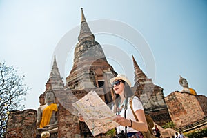 Tourist on travel sightseeing holding map